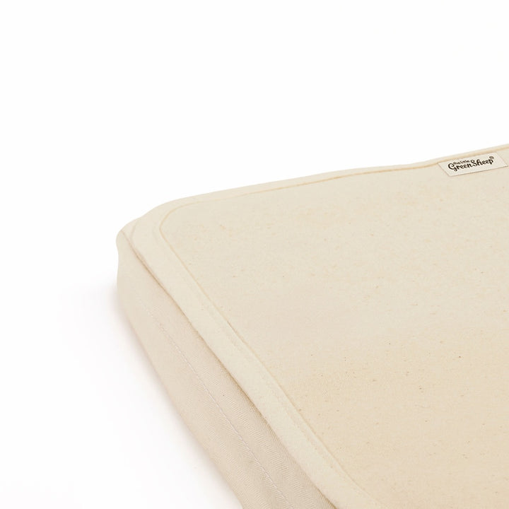 Органічний наматрацник для дитячого ліжечка