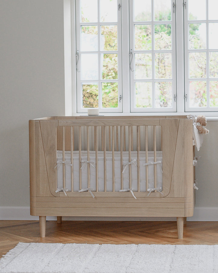 Защитный бортик для кроватки